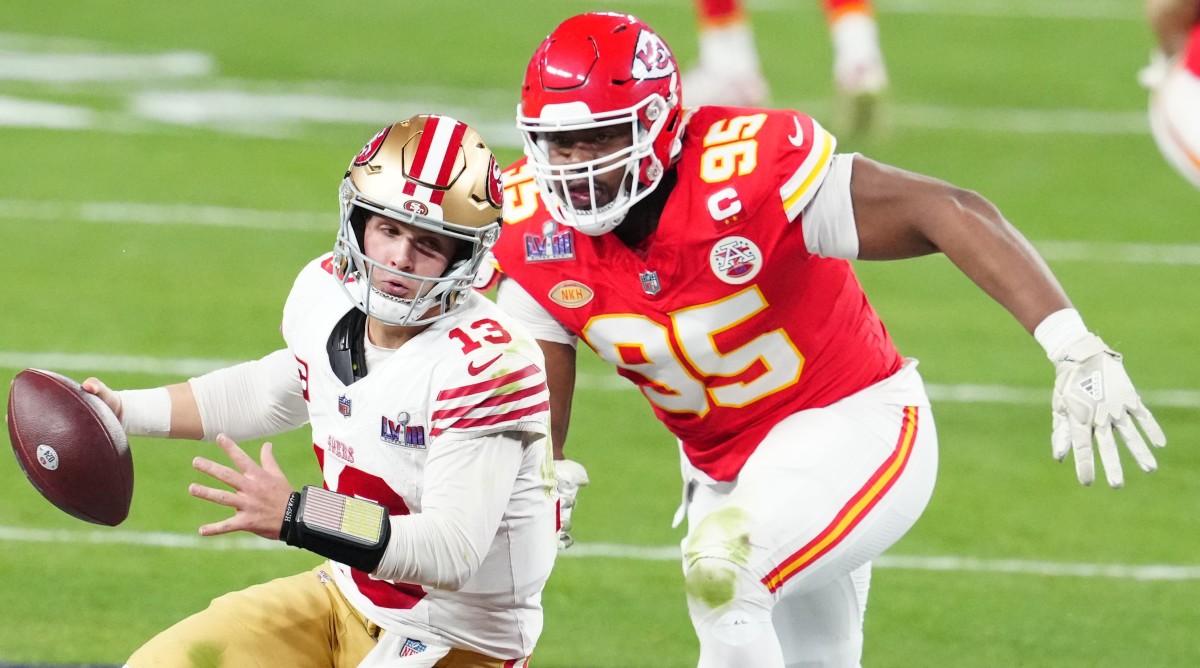San Francisco 49ers quarterback Brock Purdy (13) is pressured by Kansas City Chiefs defensive tackle Chris Jones (95) in the second half in Super Bowl LVIII.